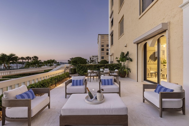 patio terrace at dusk with outdoor lounge area