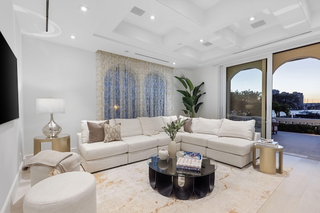 living room with coffered ceiling, beam ceiling, and light hardwood / wood-style floors