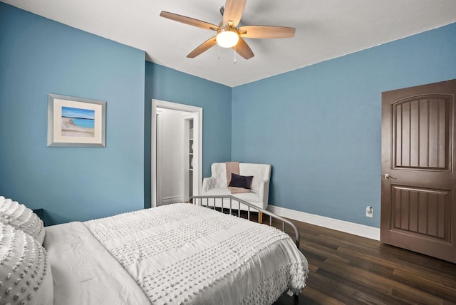 bedroom with ceiling fan and dark hardwood / wood-style flooring