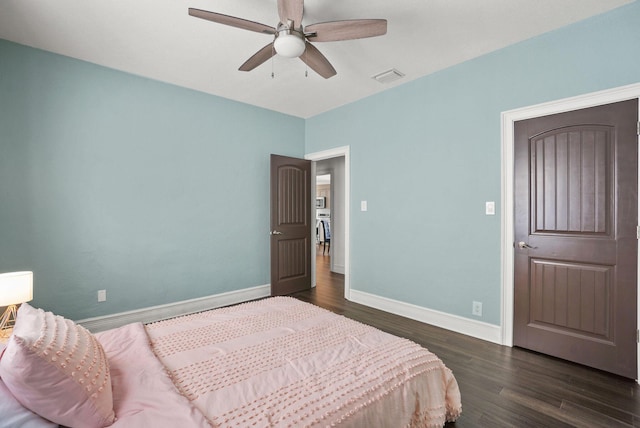 bedroom featuring ceiling fan and dark wood-type flooring