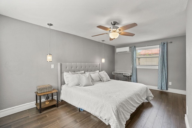 bedroom with a wall mounted AC, dark wood-type flooring, and ceiling fan