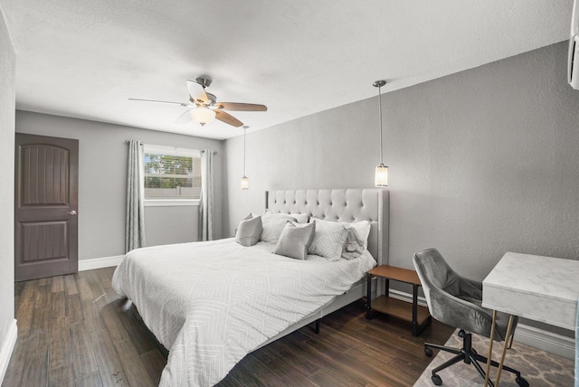 bedroom featuring dark hardwood / wood-style floors and ceiling fan