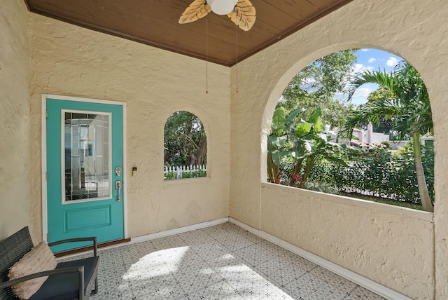 doorway to property featuring ceiling fan