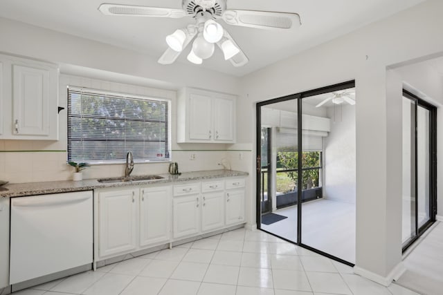 kitchen with decorative backsplash, white cabinetry, dishwasher, and sink