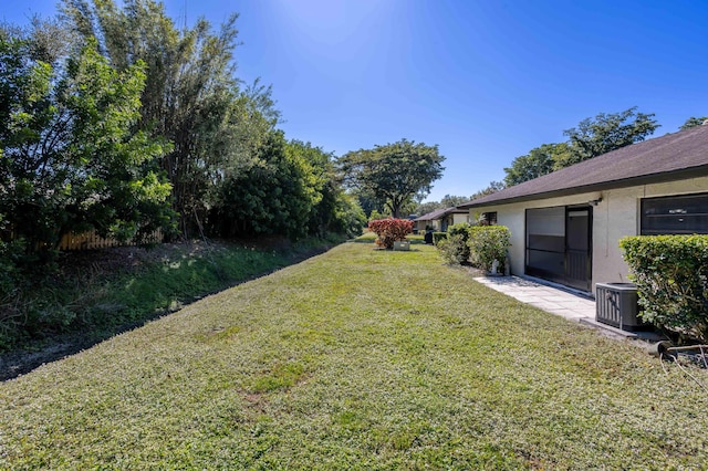 view of yard featuring central AC