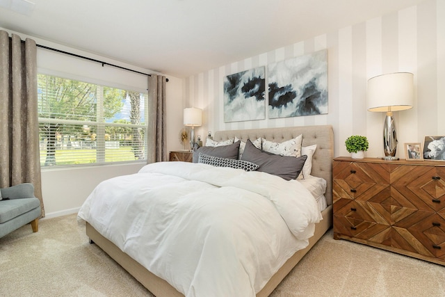 bedroom featuring carpet floors and baseboards