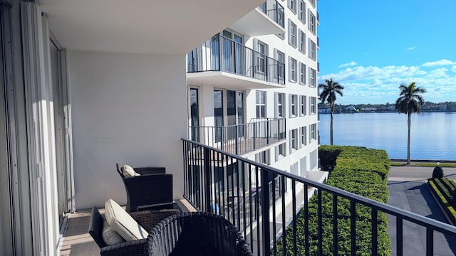 balcony featuring a water view