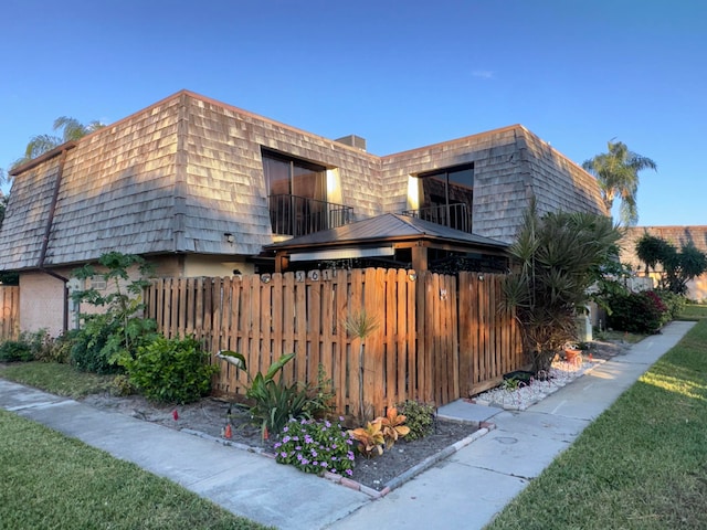 view of home's exterior with a balcony