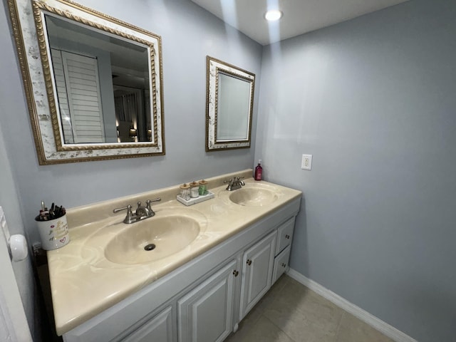 bathroom with vanity and tile patterned flooring