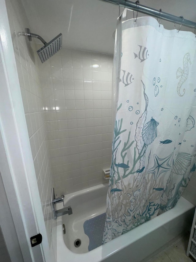 bathroom with shower / bath combination with curtain