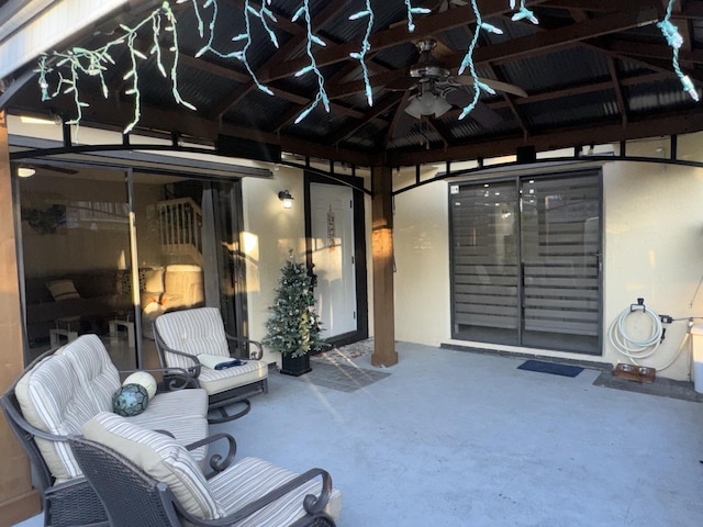 view of patio / terrace featuring a gazebo and ceiling fan