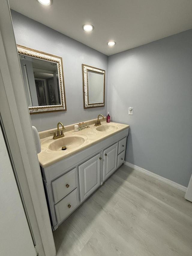 bathroom featuring vanity and hardwood / wood-style floors