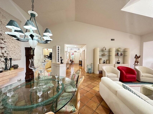 dining area with a textured ceiling, tile patterned flooring, lofted ceiling, and a notable chandelier