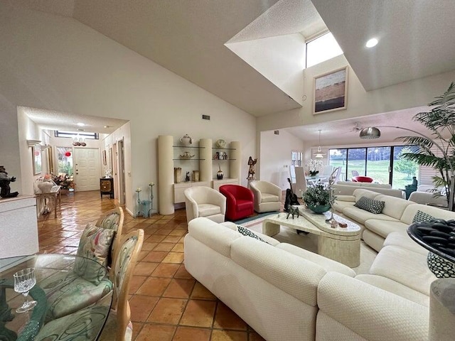 tiled living room with a textured ceiling and high vaulted ceiling