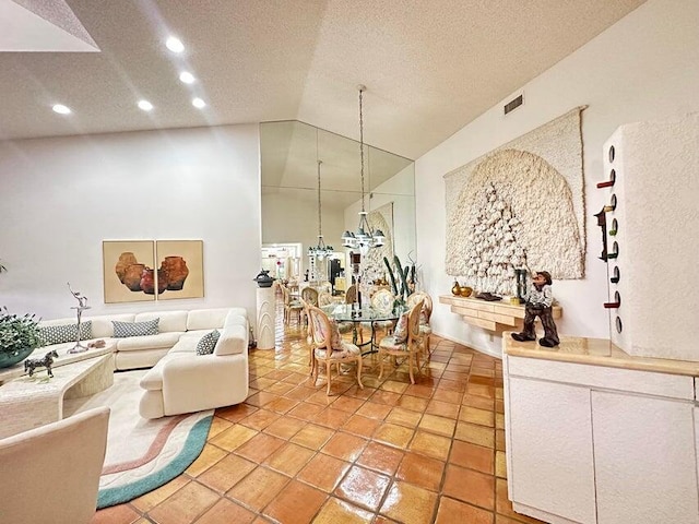 interior space featuring light tile patterned floors, a textured ceiling, and vaulted ceiling