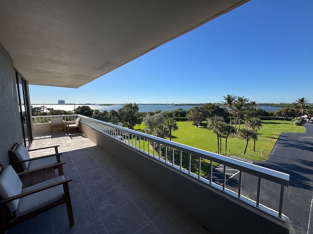 balcony featuring a water view