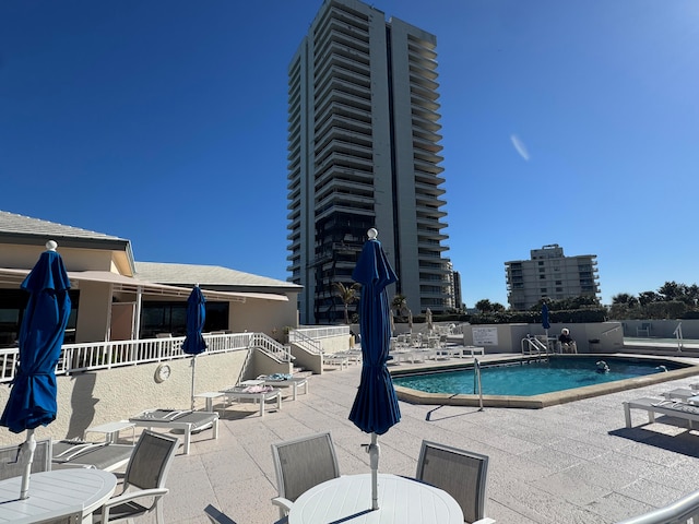 view of swimming pool with a patio