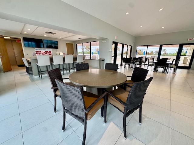 dining space featuring light tile patterned floors