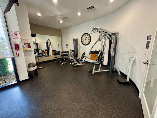 exercise room with ceiling fan