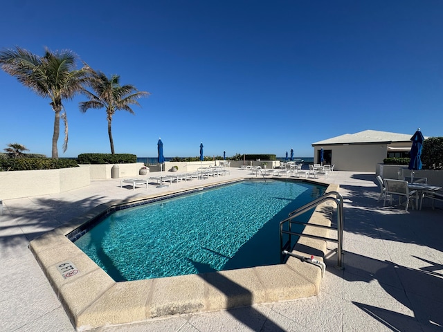 view of swimming pool with a patio