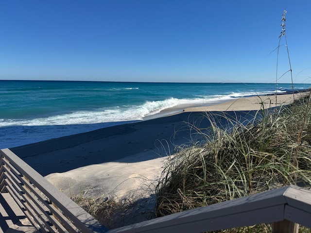 property view of water featuring a beach view