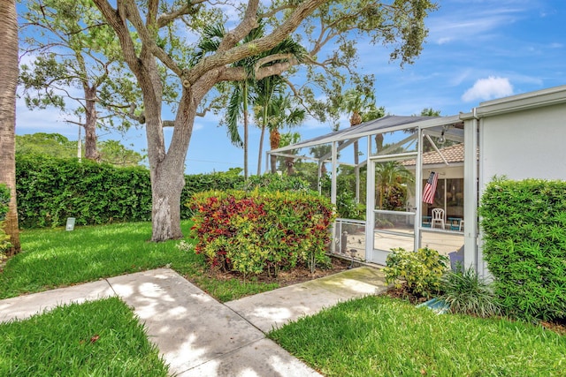 view of yard featuring glass enclosure