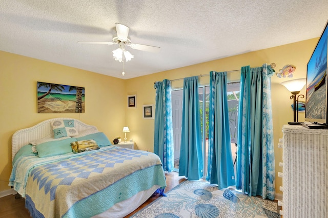 bedroom with a textured ceiling and ceiling fan