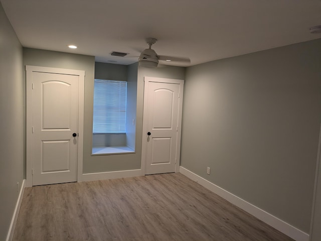 unfurnished bedroom featuring ceiling fan and light hardwood / wood-style floors