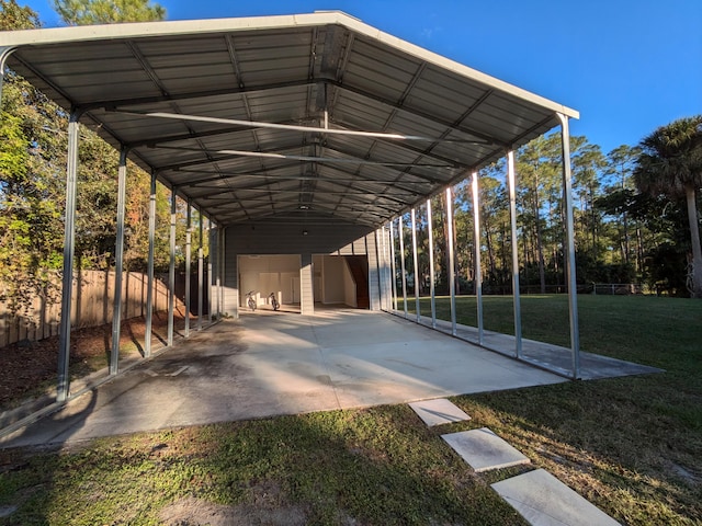 view of car parking with a yard and a carport