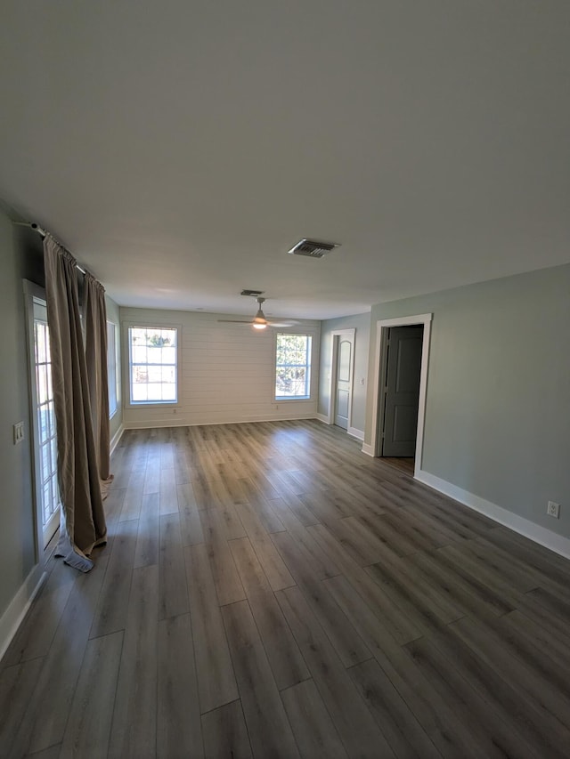 spare room featuring wood-type flooring and a wealth of natural light