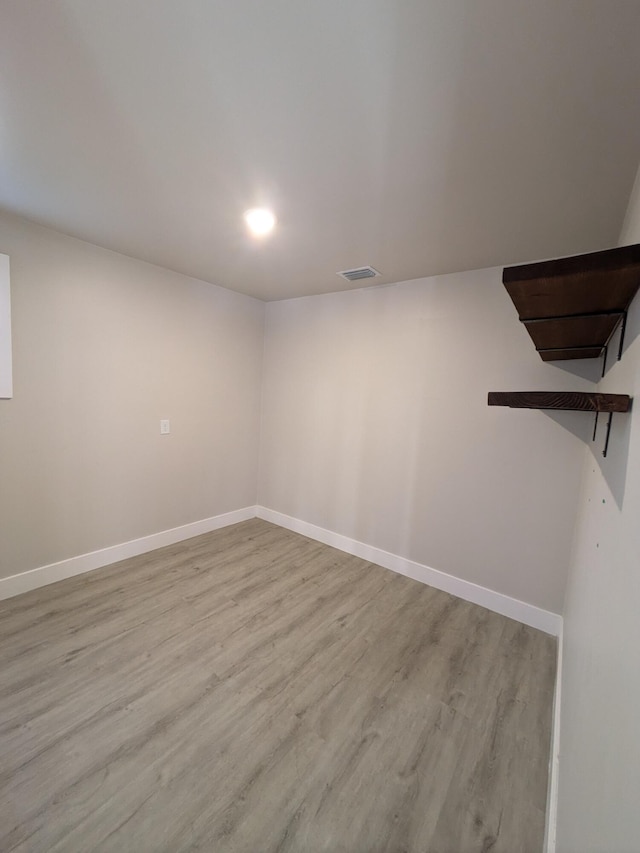 empty room with light hardwood / wood-style floors