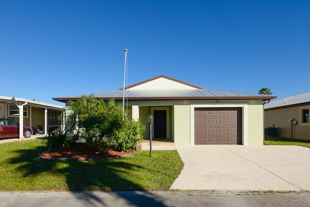 view of front of house featuring a front yard and a garage