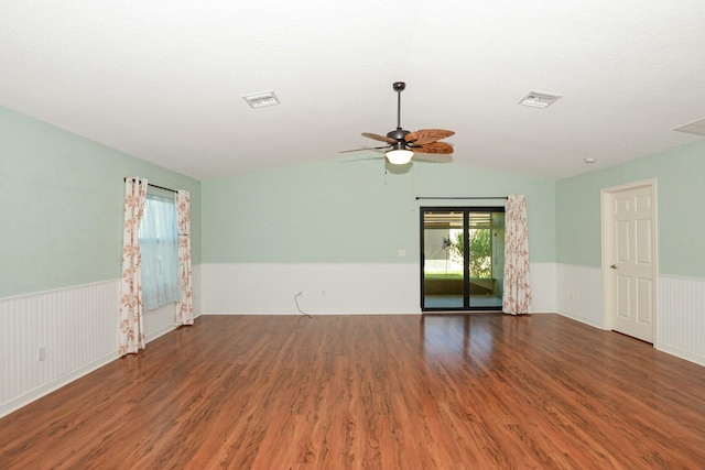 spare room featuring lofted ceiling, ceiling fan, and dark hardwood / wood-style floors