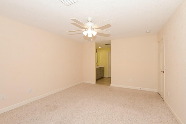 unfurnished room featuring light carpet and ceiling fan