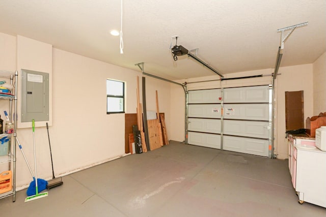 garage with electric panel and a garage door opener