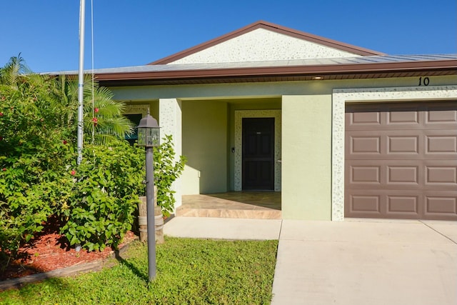 view of front of home with a porch and a garage