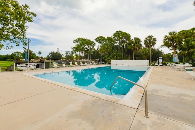 view of swimming pool with a patio