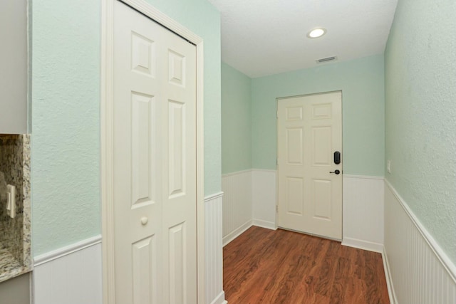 doorway to outside with dark hardwood / wood-style floors