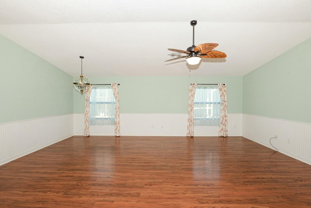 unfurnished room featuring ceiling fan, dark hardwood / wood-style flooring, a healthy amount of sunlight, and lofted ceiling