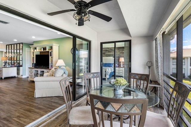 interior space featuring dark hardwood / wood-style flooring and ceiling fan