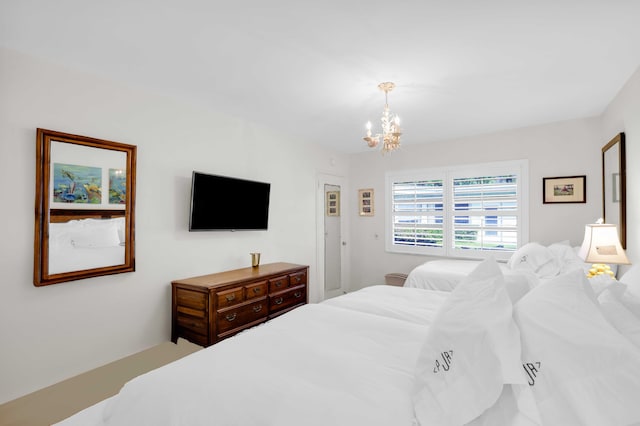 bedroom featuring a chandelier