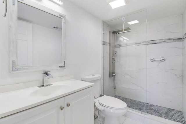 bathroom with vanity, toilet, and walk in shower