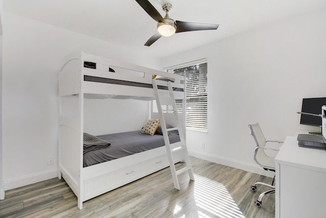 bedroom featuring wood-type flooring and ceiling fan