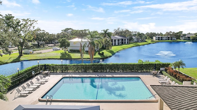 view of pool with a water view