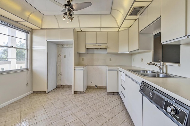 kitchen featuring ceiling fan, dishwasher, light tile patterned floors, and sink