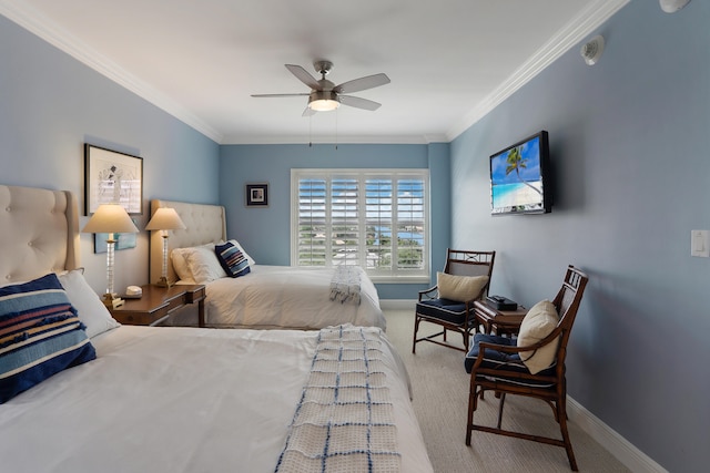 bedroom featuring carpet flooring, ceiling fan, and crown molding