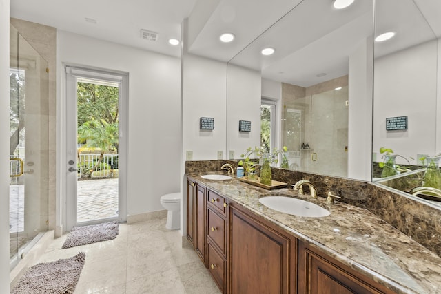 bathroom with vanity, toilet, and walk in shower