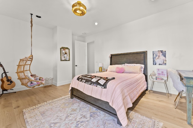 bedroom with wood-type flooring