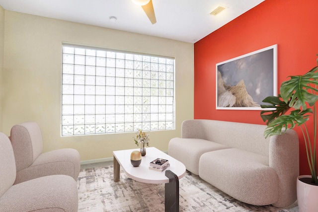 living area with ceiling fan