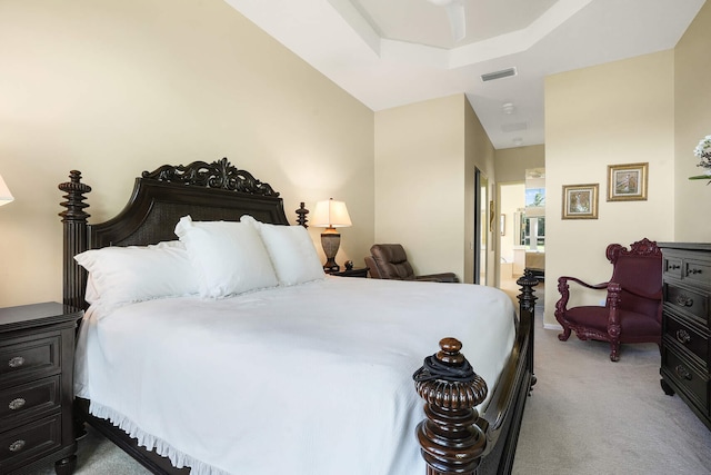 carpeted bedroom featuring visible vents